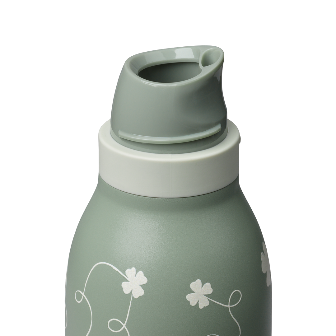 Owala FreeSip Twist 24oz, sage green body with white clover pattern, twist cap removed showing sage green FreeSip spout